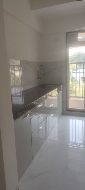 Kitchen in 1 BHK Apartment at Metropolis Bayside, Kasarvadavali – for Rent