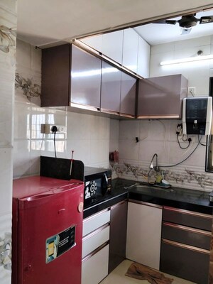 Kitchen in 2 BHK Apartment at Ideal Pristine Tower, Kasarvadavali – for Rent