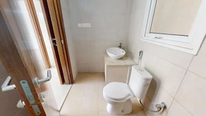 Bathroom in 2 BHK Apartment at Bhartiya Nikoo Homes, Thanisandra Main Road – for Sale