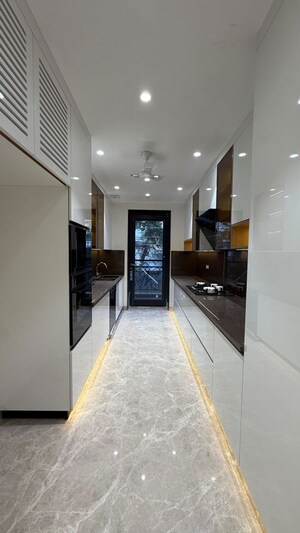 Kitchen in 4 BHK Builder Floor at Sushant Lok I – for Sale