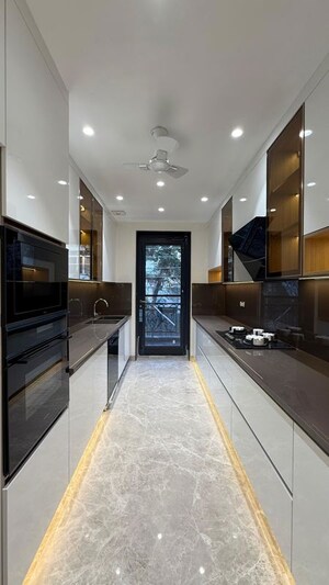 Kitchen in 4 BHK Builder Floor at Sushant Lok I – for Sale
