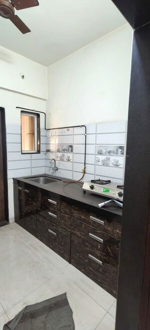 Kitchen in 1 BHK Apartment at Rajaram Sukur Enclave D Wing, Ghodbunder Road – for Sale