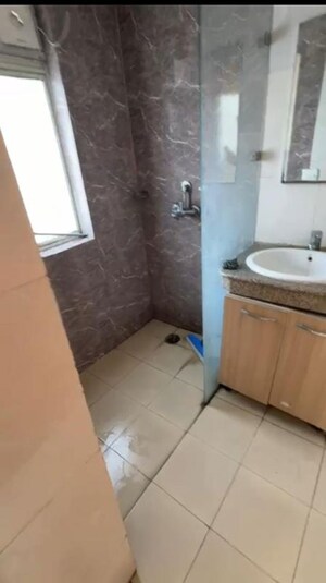 Bathroom in Studio Apartment at Nimbus The Golden Palm, Sector 168 – for Rent