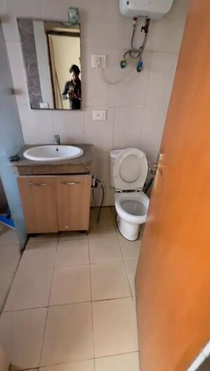 Bathroom in Studio Apartment at Nimbus The Golden Palm, Sector 168 – for Rent