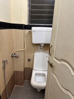 Bathroom in 2 BHK Apartment at Tulip Park CHS, Andheri East – for Rent