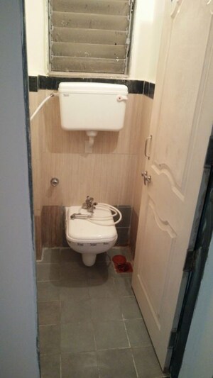 Bathroom in 2 BHK Apartment at Tulip Park CHS, Andheri East – for Rent