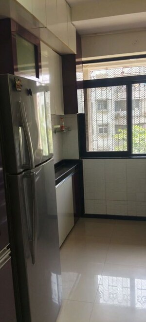 Kitchen in 1 BHK Apartment at Vasant Sagar, Kandivali East – for Sale