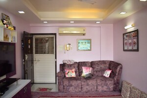 Living Room in 2 BHK Apartment at Gulmohar Queenstown, Kharadi – for Sale