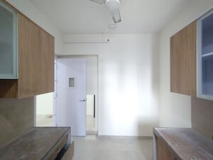 Kitchen in 2.5 BHK Apartment at T Bhimjyani Neelkanth Woods Olivia, Ghodbunder Road – for Rent