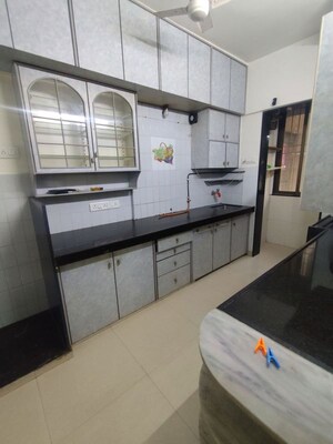 Kitchen in 2 BHK Apartment at Mota Mahal Apartment, Andheri West – for Rent