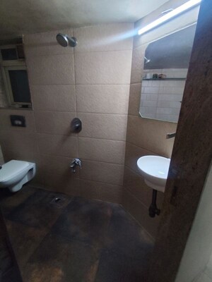 Bathroom in 2 BHK Apartment at Mota Mahal Apartment, Andheri West – for Rent