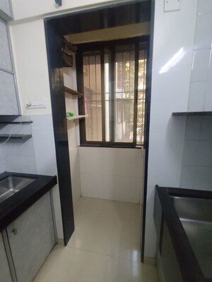 Kitchen in 2 BHK Apartment at Mota Mahal Apartment, Andheri West – for Rent