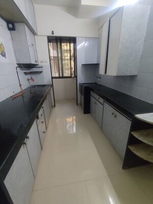 Kitchen in 2 BHK Apartment at Mota Mahal Apartment, Andheri West – for Rent
