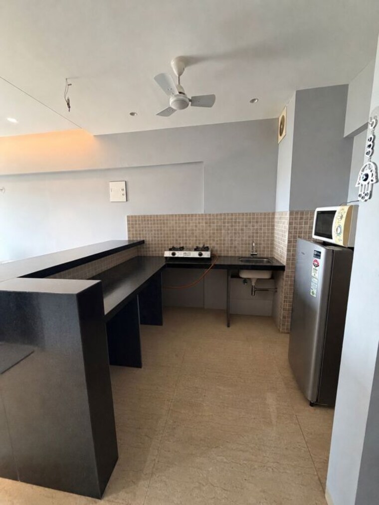 Kitchen, lodha-belmondo 1 Bedroom 711 Sq.Ft. Apartment In Gahunje Pune 10784606