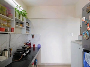 Kitchen in 1.5 BHK Apartment at Man Opus, Mira Road – for Sale