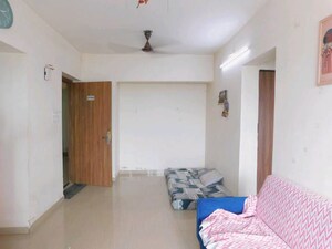 Living Room in 1.5 BHK Apartment at Man Opus, Mira Road – for Sale