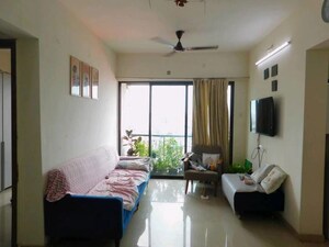 Living Room in 1.5 BHK Apartment at Man Opus, Mira Road – for Sale
