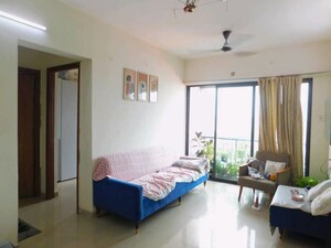 Living Room in 1.5 BHK Apartment at Man Opus, Mira Road – for Sale