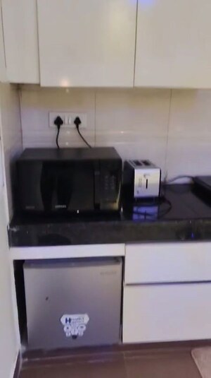 Kitchen in Studio Apartment at Nimbus The Golden Palm, Sector 168 – for Sale