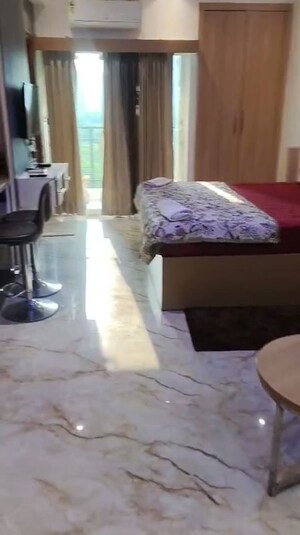 Living Room in 1 RK Apartment at Nimbus The Golden Palm, Sector 168 – for Rent