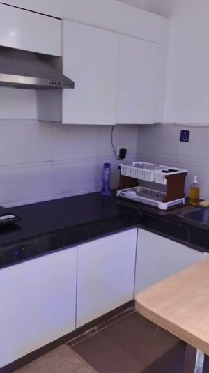 Kitchen in 1 RK Apartment at Nimbus The Golden Palm, Sector 168 – for Rent