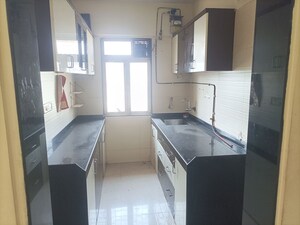 Kitchen in 2 BHK Apartment at Cosmos Classique, Ghodbunder Road – for Rent