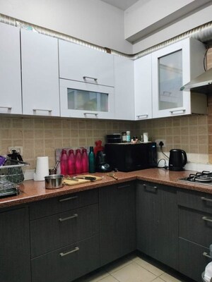Kitchen in 3 BHK Apartment at Mahagun Moderne, Sector 78 – for Rent