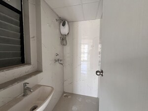 Bathroom in 1 BHK Apartment at Runwal Gardens, Dombivli East – for Sale