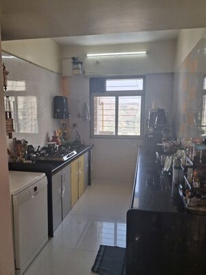 Kitchen in 2 BHK Apartment at Cosmos Lounge, Manpada – for Sale