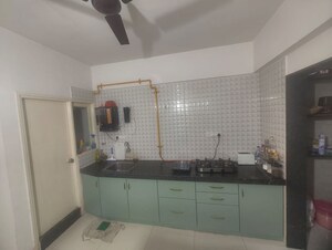 Kitchen in 2 BHK Apartment at Shivam Grace, Ghatlodia – for Sale