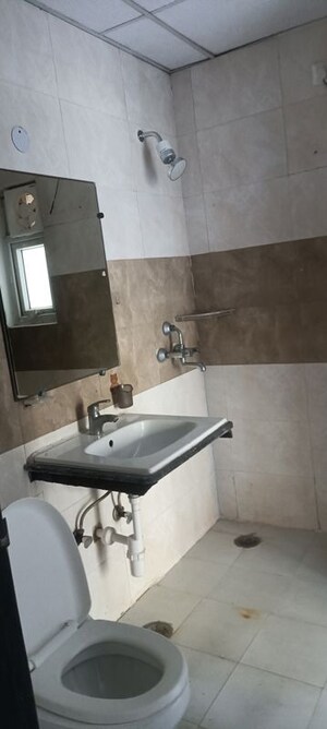Bathroom in 3 BHK Apartment at Aims Golf City, Sector 75 – for Rent
