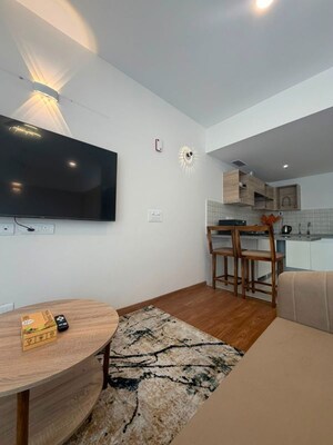 Living Room in Studio Apartment at Godrej Golf Links Evoke, Sector 27 Yamuna Expressway – for Rent