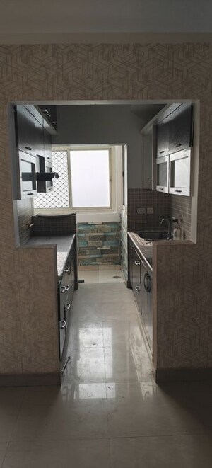 Kitchen in 2.5 BHK Apartment at Sikka Karmic Greens, Sector 78 – for Rent