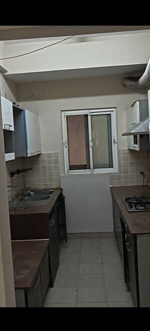 Kitchen in 2.5 BHK Apartment at Mahagun Moderne, Sector 78 – for Rent