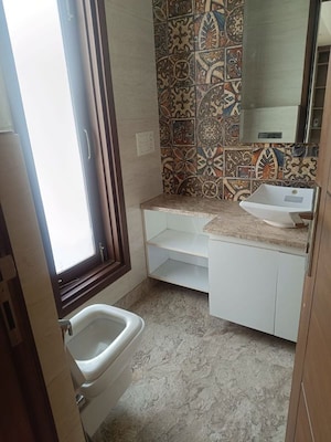 Bathroom in 4 BHK Builder Floor at Green Park Extension – for Rent