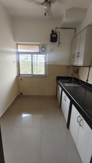 Kitchen in 2 BHK Apartment at Kalpataru Hills, Manpada – for Rent