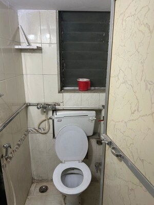 Bathroom in 1 BHK Apartment at Raunak Charnamrut CHS, Ghodbunder Road – for Rent