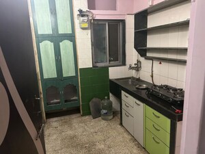 Kitchen in 1 BHK Apartment at Raunak Charnamrut CHS, Ghodbunder Road – for Rent