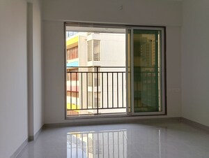 Room in 1 BHK Apartment at Ajmera Boulevard, Malad West – for Rent