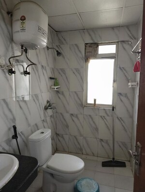 Bathroom in 2 BHK Apartment at Nimbus The Golden Palm, Sector 168 – for Rent