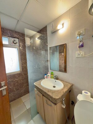 Bathroom in 1 BHK Apartment at Nimbus The Golden Palm, Sector 168 – for Sale