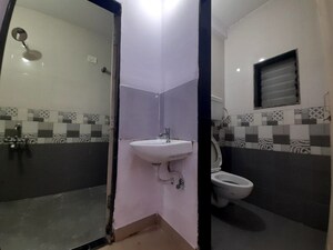 Bathroom in 1 BHK Apartment at Unnat Nagar CHS, Goregaon West – for Rent