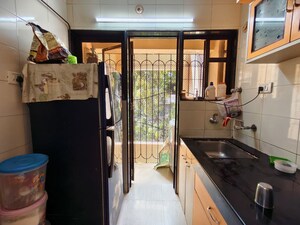Kitchen in 1.5 BHK Apartment at Babhai Naka – for Sale