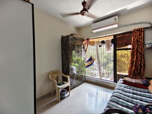 Living Room in 1.5 BHK Apartment at Babhai Naka – for Sale