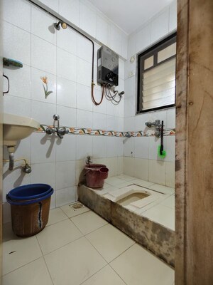 Bathroom in 1.5 BHK Apartment at Babhai Naka – for Sale