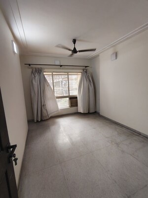 Bedroom in 2 BHK Apartment at Kingston Palace, Malad West – for Rent