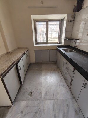 Kitchen in 2 BHK Apartment at Landmark CHS Malad, Malad West – for Rent