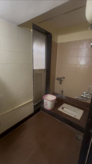 Bathroom in 2 BHK Apartment at Dosti Group Maitri Gardens, Oswal Park – for Rent