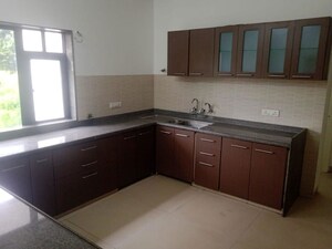 Kitchen in 4 BHK Apartment at Boat Club Road – for Sale