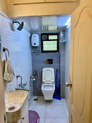 Bathroom in 2 BHK Apartment at Seven Bungalow, Andheri West – for Rent